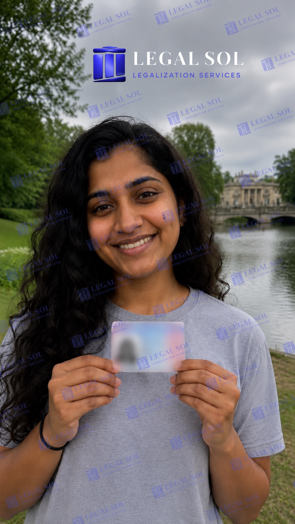 Anjali, LegalSol client at Łazienki Park holding her residence card